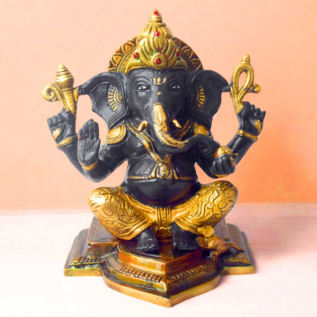 The "9.1 Inch Sacred Ganesh Idol" is a beautifully crafted statue of Lord Ganesha, symbolizing wisdom, success, and the removal of obstacles. Standing at 9.1 inches tall, it features intricate detailing and traditional attributes like the axe, lotus, and modak.