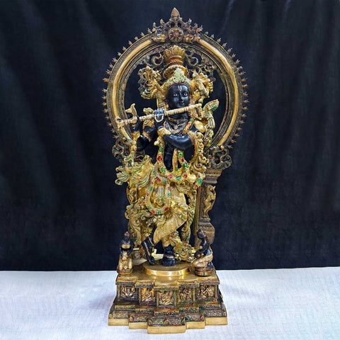  Brass Idol of 32 Inch Lord Krishna Stands on an Engraved Base with a Frame of Lord Krishna. Bring divine elegance into your home with this stunning 32-inch Lord Krishna statue. Expertly crafted with intricate details, the statue beautifully portrays Lord Krishna in a serene and graceful stance. The engraved base adds a touch of traditional artistry, while the surrounding frame enhances its majestic presence. India's Largest Puja Accessories Brand - Satvik