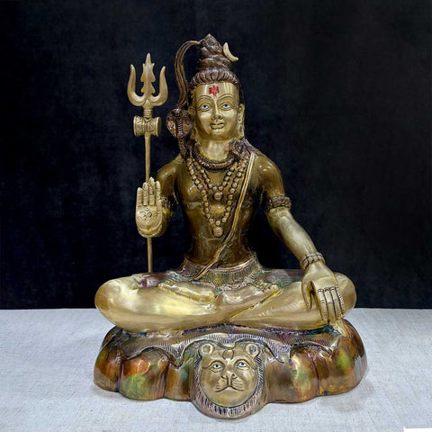  Brass Idol of 17 Inch Brass Shiva Idol in Meditative Posture. Embodying peace and spiritual focus, this 17-inch Brass Shiva Idol features Lord Shiva in a serene meditative posture. Known as the ultimate yogi, Lord Shiva is beautifully represented here with intricate detailing in brass, capturing the tranquility and profound wisdom of his meditation. India's Largest Puja Accessories Brand - Satvik No 1 Brass Idol Collection.