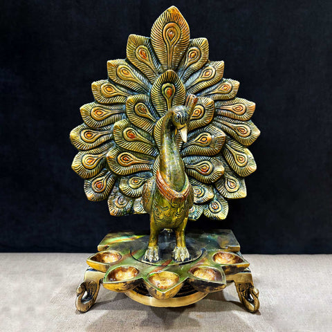 14 Inch Stylish Brass Peacock Panch Diya featuring an elegant peacock design with five diya holders, beautifully crafted for traditional rituals, home décor, and festive celebrations. India’s Largest Pooja Accessories Brand – www.satvikstore.in